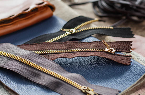 Zip and equipment on table. Zip and leather repairing equipment on the table.